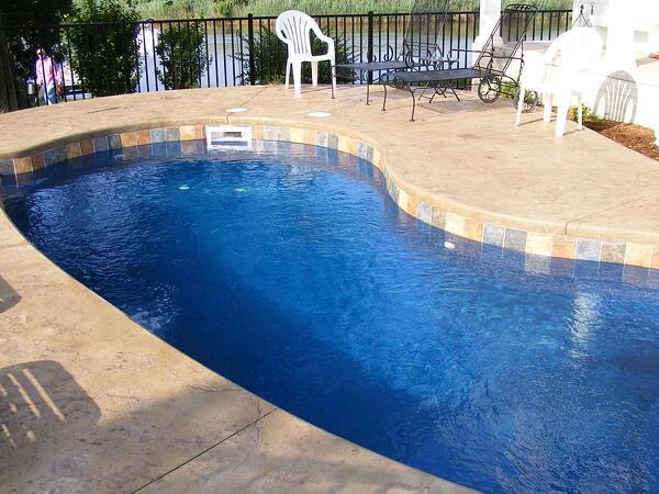 fiberglass pool with cantilevered concrete coping