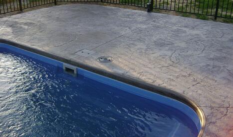 A picture of stamped (jumbo stone) concrete pool patio