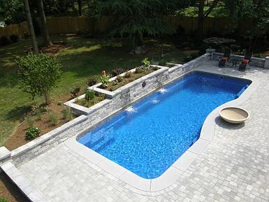 fiberglass pool with retaining wall