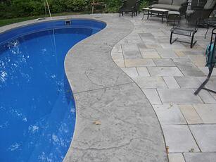 Cantilevered concrete coping around a fiberglass pool