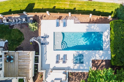 001. River Pools D40 + SS08 in Granite Gray with cascades, bubblers, and natural stone patio and coping