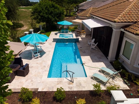 004. River Pools M30 + SS08 with spillway in Caribbean Sparkle with natural stone patio and coping