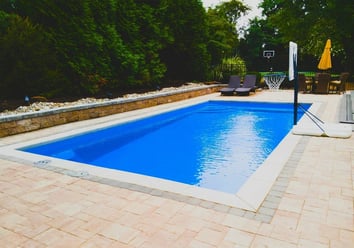006. R32 pool in Maya Blue with textured concrete border and paver patio