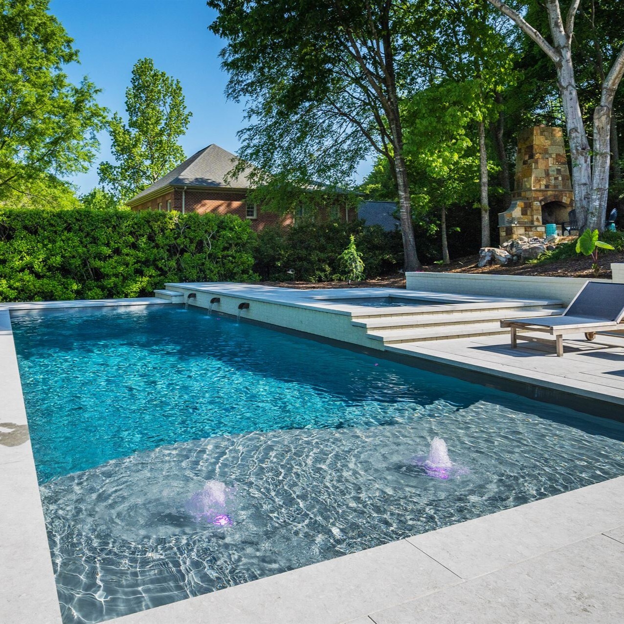 006. River Pools D40 + SS08 in Granite Gray with cascades, bubblers, and natural stone patio and coping (1)