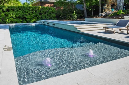006. River Pools D40 + SS08 in Granite Gray with cascades, bubblers, and natural stone patio and coping-1