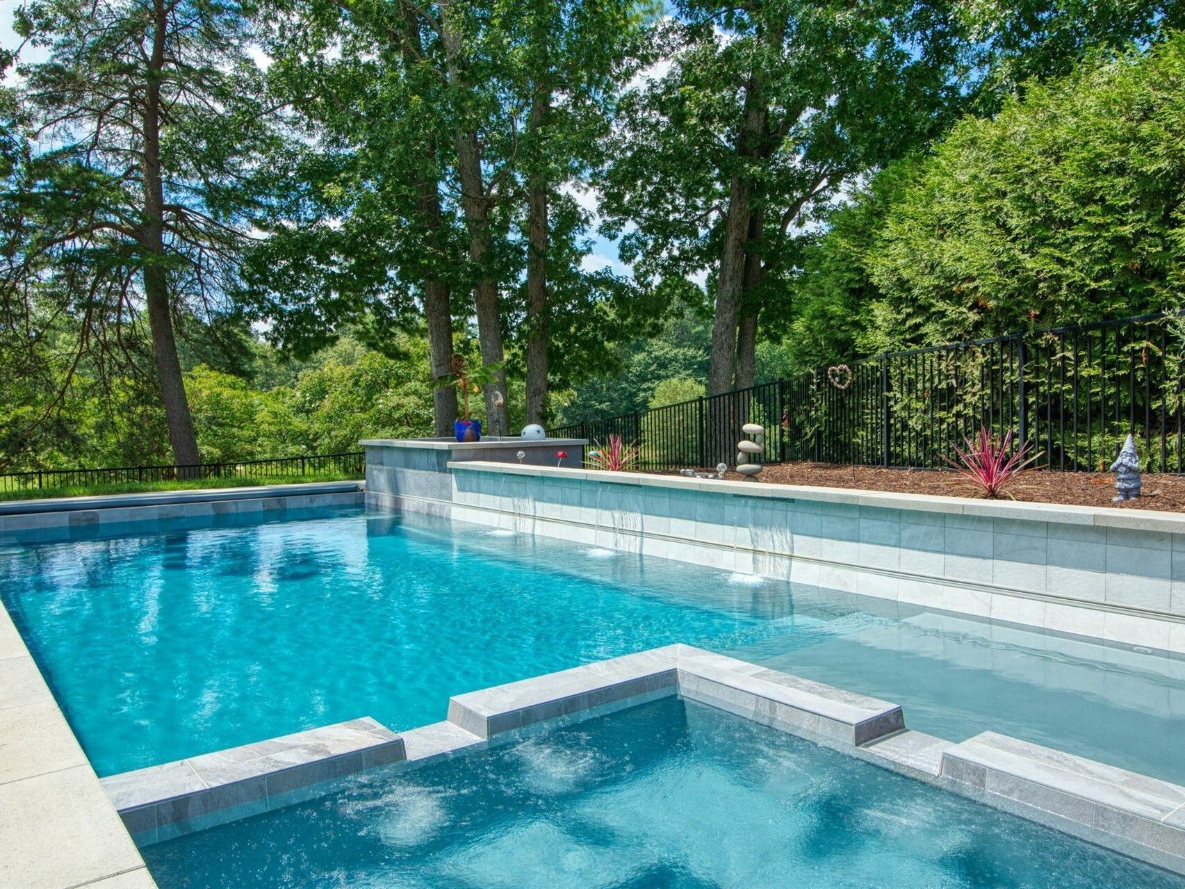 009. River Pools X36 in Granite Gray with cascade, concrete paver patio, and natural stone coping-1