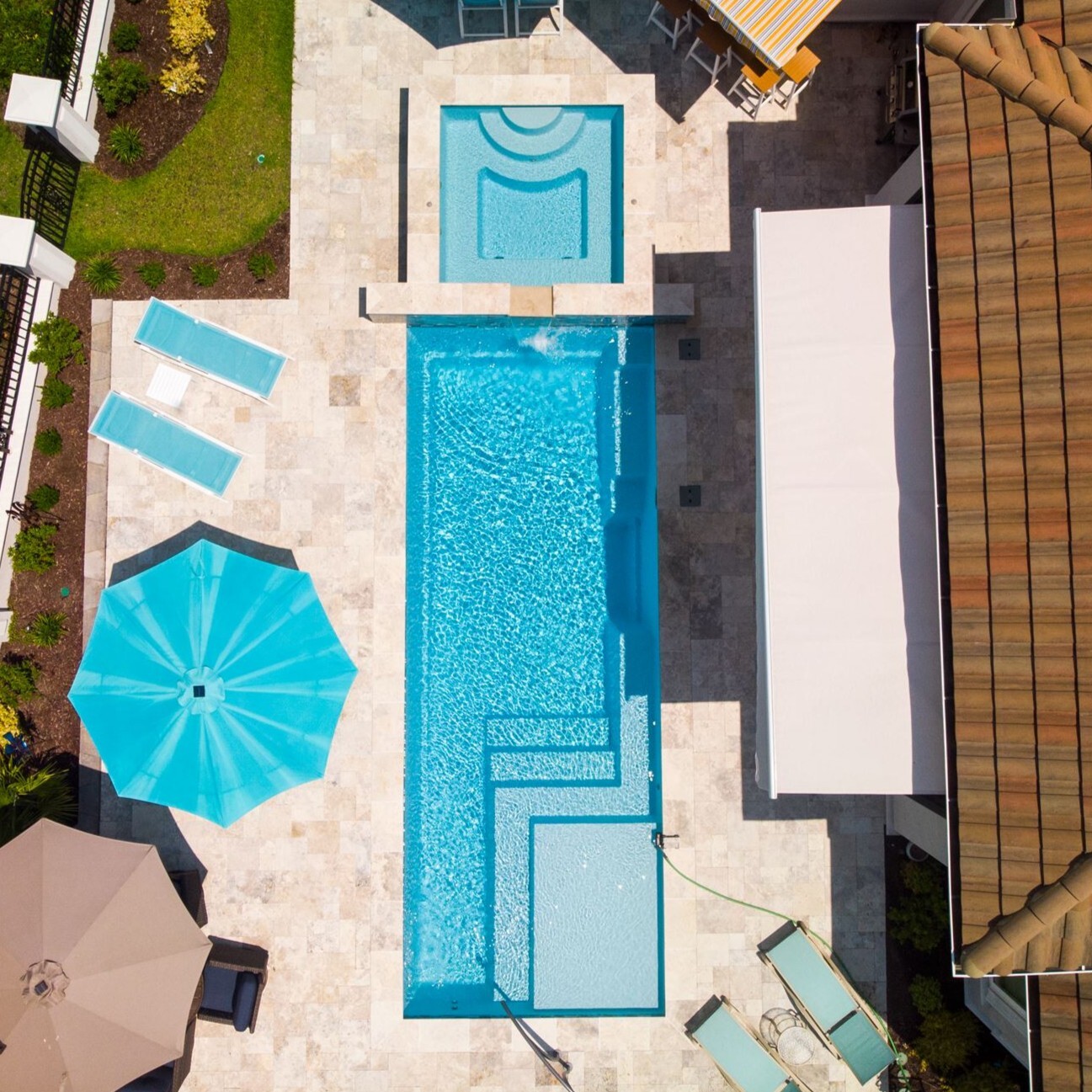 012. River Pools M30 + SS08 with spillway in Caribbean Sparkle with natural stone patio and coping