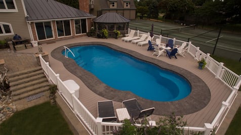 Above ground fiberglass pool with deck