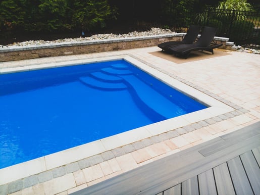 Rectangular fiberglass pool with bench seating 