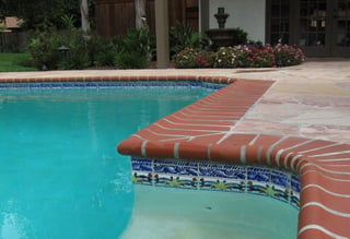 Porcelain waterline tile on a concrete pool