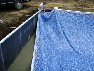 Installing vinyl liner on the pool