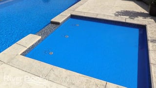 Splash pad or tanning ledge added on to a pool