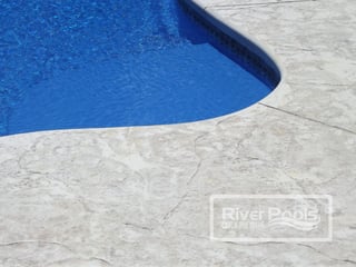 Textured concrete pool patio
