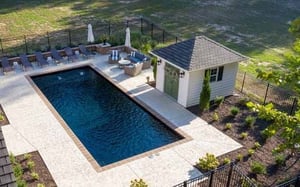 black rectangular fiberglass pool with pool house