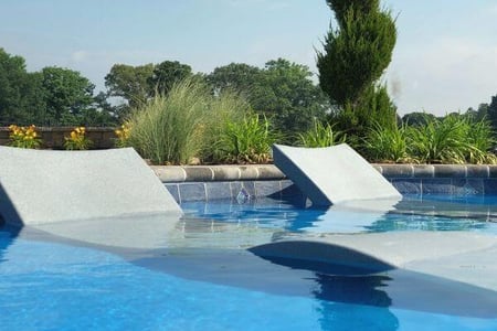 in-pool furniture on tanning ledge