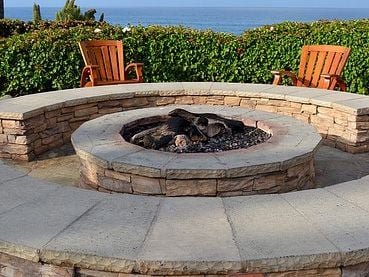 stone fire pit with bench seating