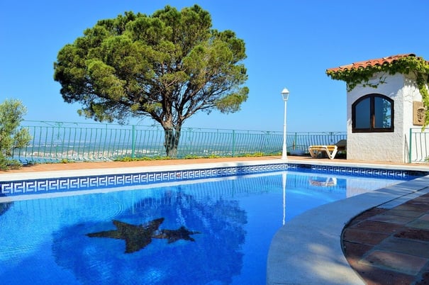 swimming pool with shade from tree