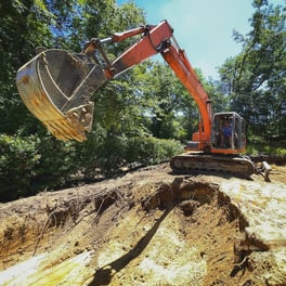 Image of excavation for a pool in progress.