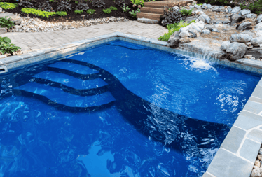 D24 small fiberglass pool with tanning ledge and seats