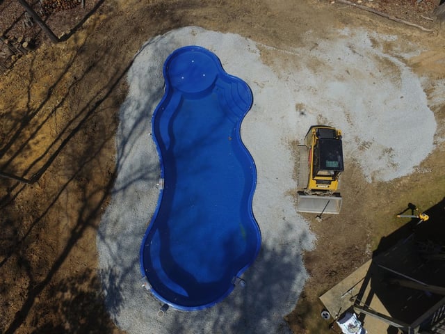 lagoon-style Wellspring fiberglass pool construction