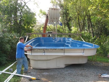 installing the plumbing around a fiberglass pool shell
