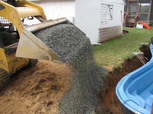 pouring gravel backfill for a fiberglass pool