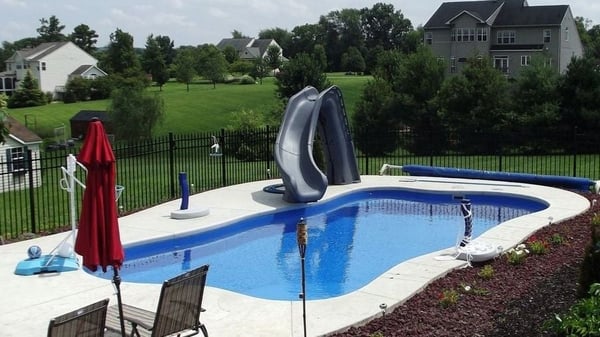 Inground pool slide with fiberglass pool