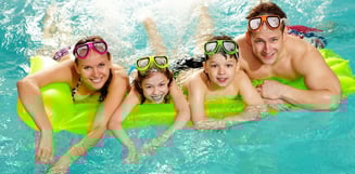 happy-family-swimming-in-pool