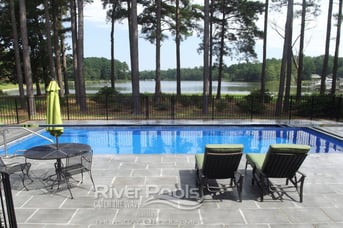 trees around fiberglass pool and patio