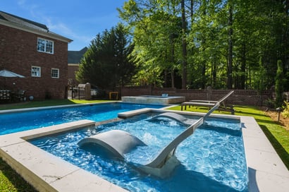 River Pools R40 + SS08 with spillway + TL15 with spillway in Granite Gray with bubblers, turf patio and natural stone coping 6