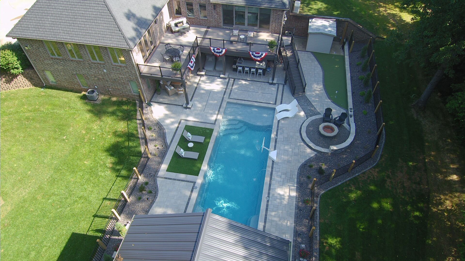 Modern inground fiberglass pool in Nixa, MO featuring rectangle design and structured landscaping