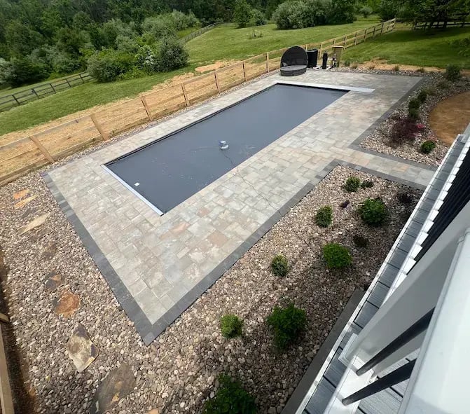 Fiberglass pool installed with paver decking in Suffolk, VA. 