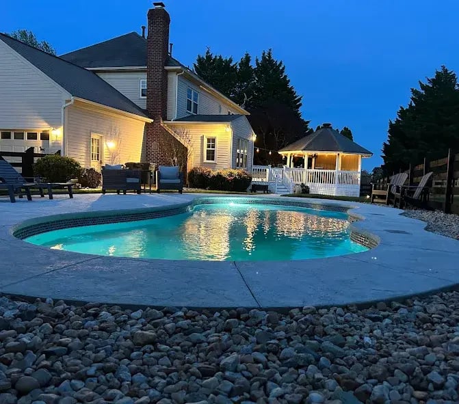 Fiberglass pool at night in Yorktown.