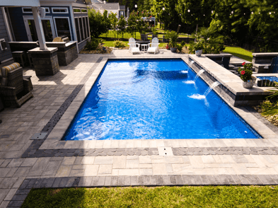 d-series-fiberglass-pool-tan-pavers-sun-shelf