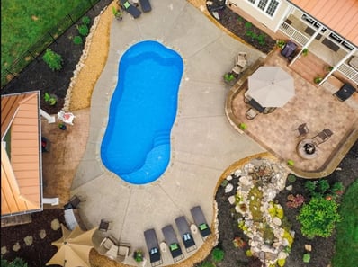 Aerial view of blue freeform fiberglass pool