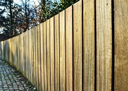 Raw wood pool fence