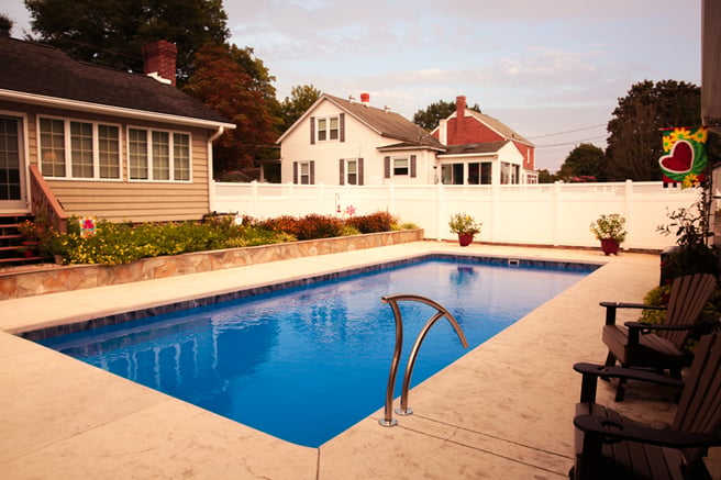 Rectangular blue fiberglass pool.