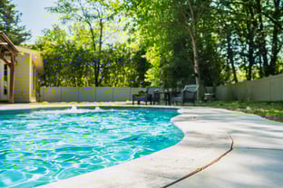 River Pools C35 in Diamond color with bubblers, brushed concrete and natural stone coping