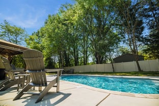 River Pools C35 in Diamond color with bubblers, brushed concrete and natural stone coping