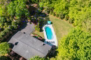 River Pools C40 in Diamond color with brushed concrete and natural stone coping