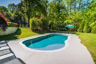 River Pools C40 in Diamond with brushed concrete and natural stone coping