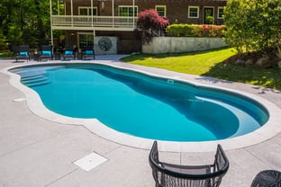 River Pools C40 in Diamond with brushed concrete and natural stone coping