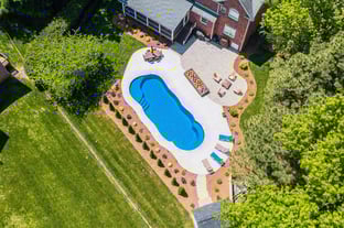 River Pools C40 in Maya Shimmer with brushed concrete and natural stone coping