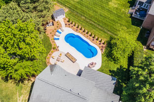 River Pools C40 in Maya Shimmer with brushed concrete and natural stone coping