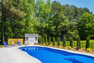 River Pools C40 in Maya Shimmer with brushed concrete and natural stone coping