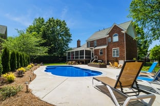 River Pools C40 in Maya Shimmer with brushed concrete and natural stone coping