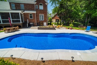 River Pools C40 in Maya Shimmer with brushed concrete and natural stone coping