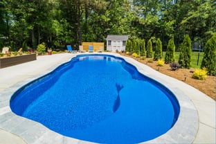 River Pools C40 in Maya Shimmer with brushed concrete and natural stone coping