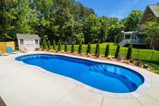 River Pools C40 in Maya Shimmer with brushed concrete and natural stone coping