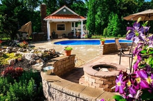 Fire pit and sitting alcove next to C40 pool in maya blue